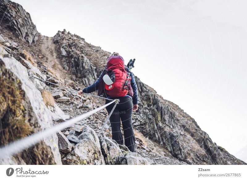 Young woman on the via ferrata Leisure and hobbies Vacation & Travel Expedition Hiking Climbing Mountaineering Youth (Young adults) 18 - 30 years Adults Nature
