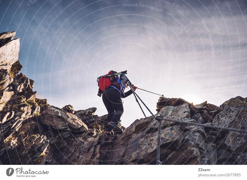 Young woman on the via ferrata Leisure and hobbies Freedom Expedition Mountain Hiking Climbing Mountaineering Youth (Young adults) Nature Landscape Sky