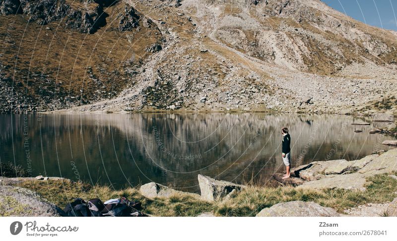 Young man in front of a mountain lake in South Tyrol | E5 Alpine crossing Vacation & Travel Adventure Summer vacation Mountain Hiking Climbing Mountaineering