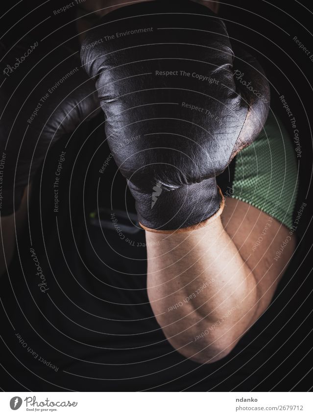 athlete is standing in a boxing rack Fitness Sports Sports Training Track and Field Sportsperson Success Hand 1 Human being 30 - 45 years Adults Leather Gloves