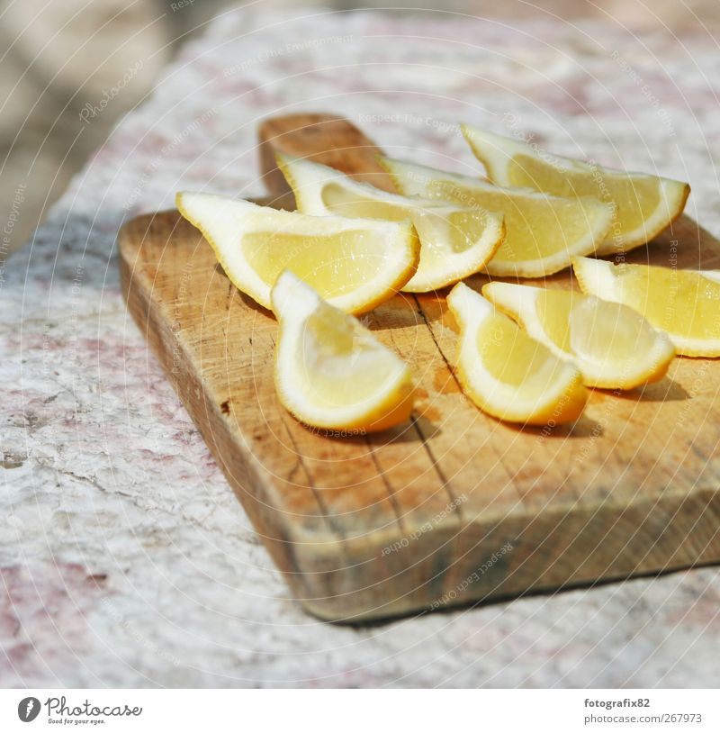 Limón, how about some refreshment? Food Nutrition Exotic Life Fresh Lemon Citrus fruits Yellow Chopping board Stone Summer's day Majorca Colour photo