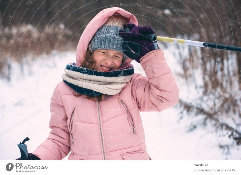 happy child girl skiing in winter snowy forest Joy Leisure and hobbies Vacation & Travel Adventure Winter Snow Winter vacation Sports Skis Child Girl