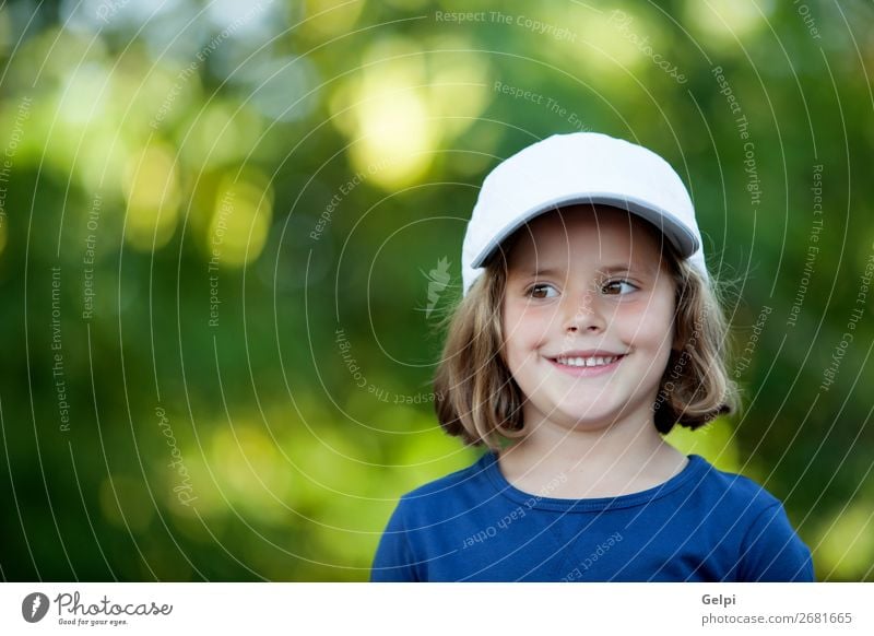 Little cute girl with a cap in the park Joy Happy Beautiful Face Life Relaxation Leisure and hobbies Vacation & Travel Freedom Camping Summer Child Human being