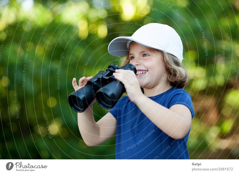 Little cute girl in the park looking by binoculars Joy Happy Beautiful Face Life Leisure and hobbies Vacation & Travel Camping Summer Child Human being Toddler