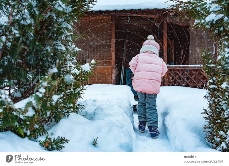 kid girl helping to clean pathway from snow with shovel Playing Winter Snow House (Residential Structure) Garden Child Tool Weather Storm Snowfall Happiness