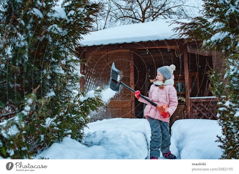 kid girl helping to clean pathway from snow with shovel Playing Winter Snow House (Residential Structure) Garden Child Tool Weather Storm Snowfall Happiness