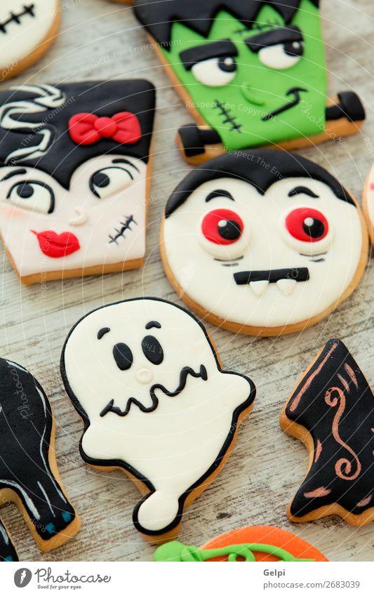 Halloween cookies with different shapes Dessert Joy Face Decoration Table Feasts & Celebrations Hallowe'en Autumn Wood Smiling Creepy Delicious Brown Black