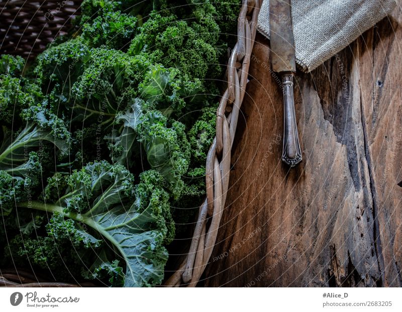 Fresh kale leaves in basket with wooden board Food Vegetable Lettuce Salad Cabbage Kale Kale leaf Nutrition Organic produce Vegetarian diet Diet Fasting Knives