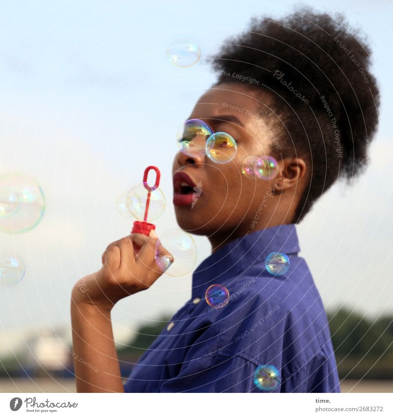 seriousbubbles Feminine Woman Adults 1 Human being Sky Horizon Beautiful weather Shirt Black-haired Long-haired Afro Soap bubble Observe To hold on To enjoy