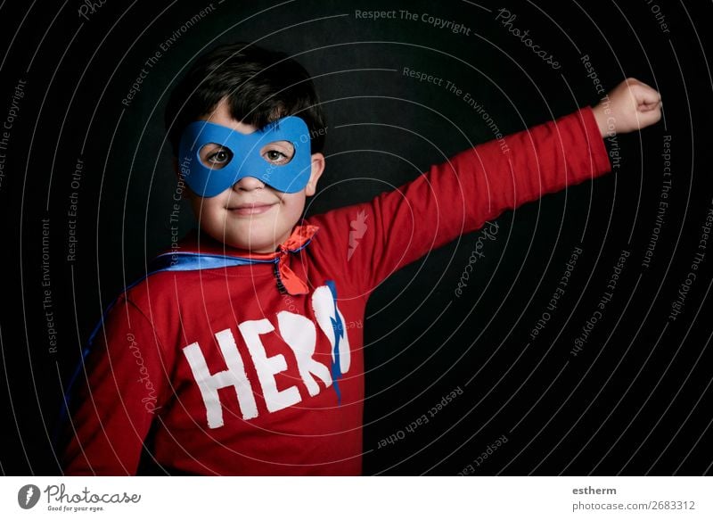 Portrait of boy in superhero costume on black background Lifestyle Joy Playing Adventure Freedom Feasts & Celebrations Fairs & Carnivals Birthday Success