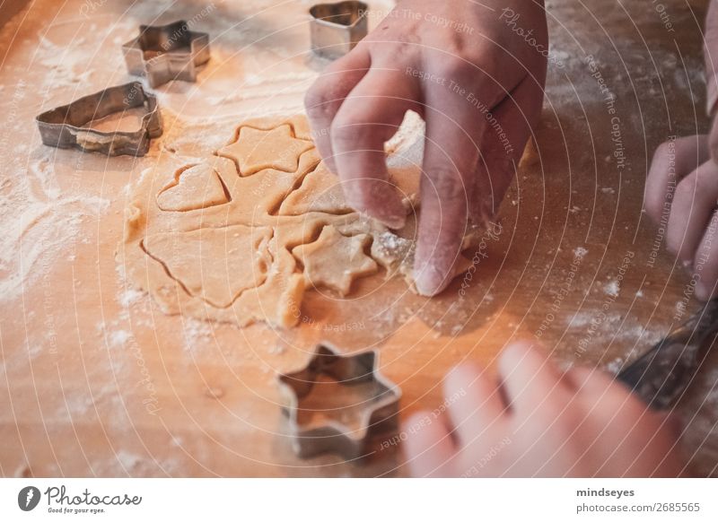 Christmas biscuits cut out Food Dough Baked goods Nutrition cut out cookies Flour Star (Symbol) Chopping board Kitchen Human being Hand Fragrance