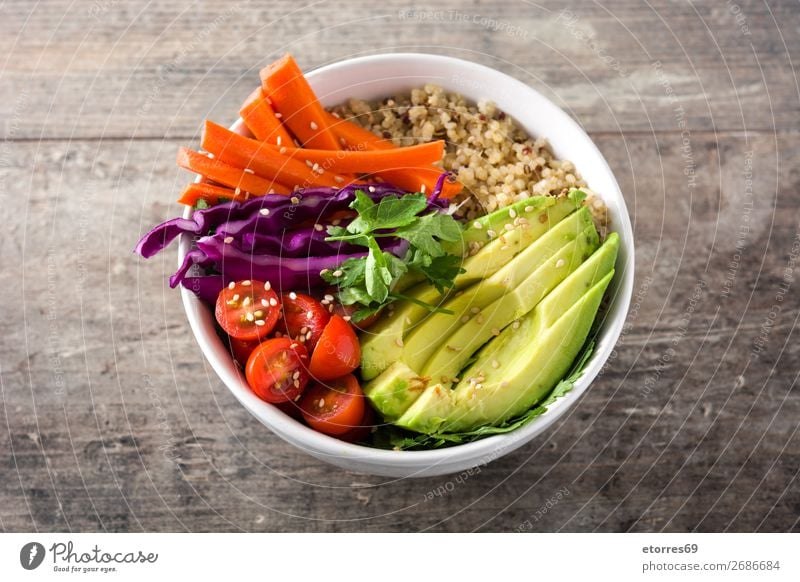 Vegan Buddha bowl with fresh raw vegetables and quinoa on wood buddha bowl Bowl Vegetable Avocado Onion Tomato Carrot Cabbage Food Healthy Eating