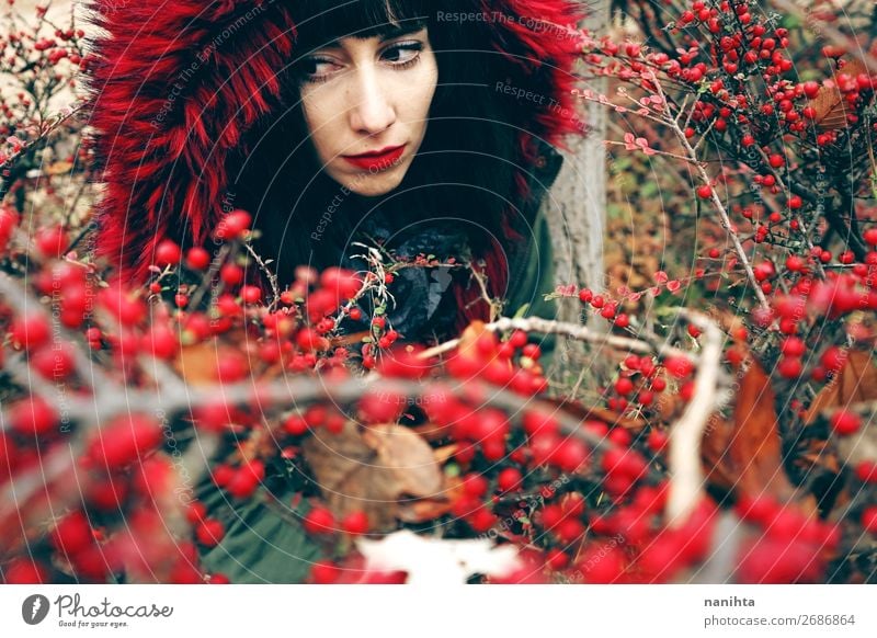 beautiful young brunette woman in red with hood Lifestyle Style Beautiful Face Winter Human being Feminine Young woman Youth (Young adults) Woman Adults 1