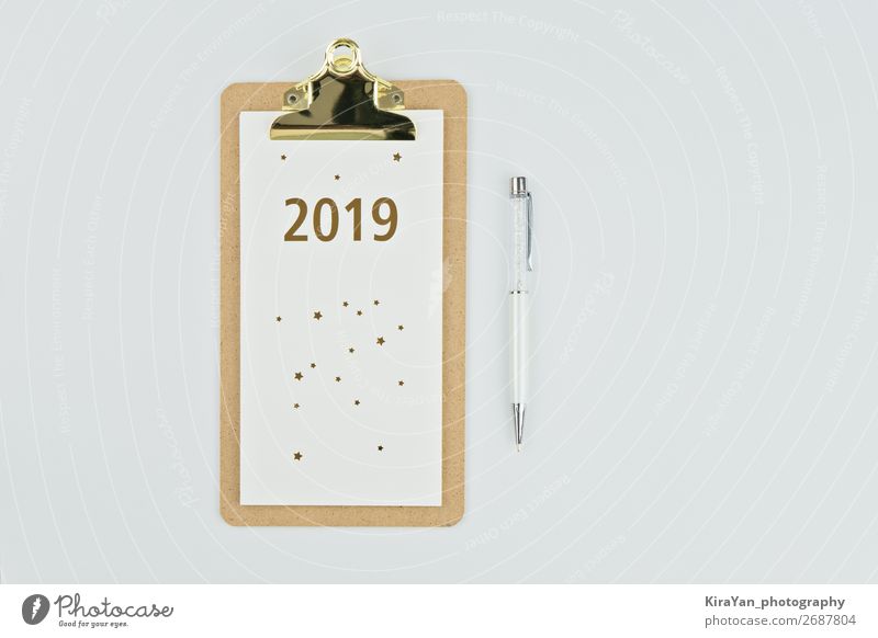 New year 2019 calendar with notebook and pen on white Design Table New Year's Eve Success Paper Pen Wood White Beginning Inspiration Future goal solution