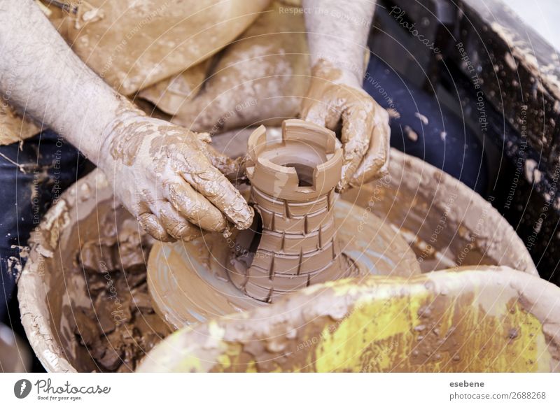 Potter makes on pottery wheel clay pot., Stock image