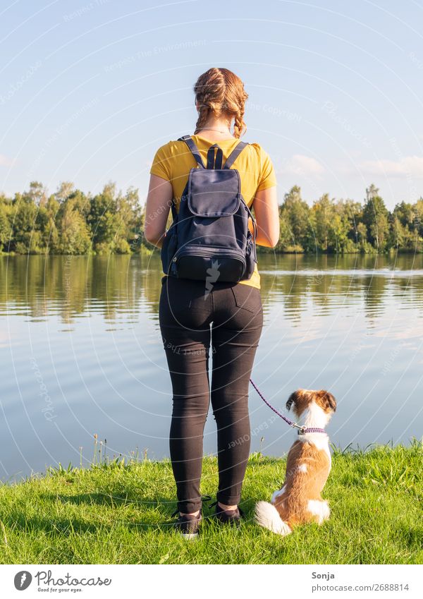 Young woman with small dog at the lake Lifestyle Summer Hiking Human being Feminine Youth (Young adults) 1 18 - 30 years Adults T-shirt Jeans Braids Dog Animal