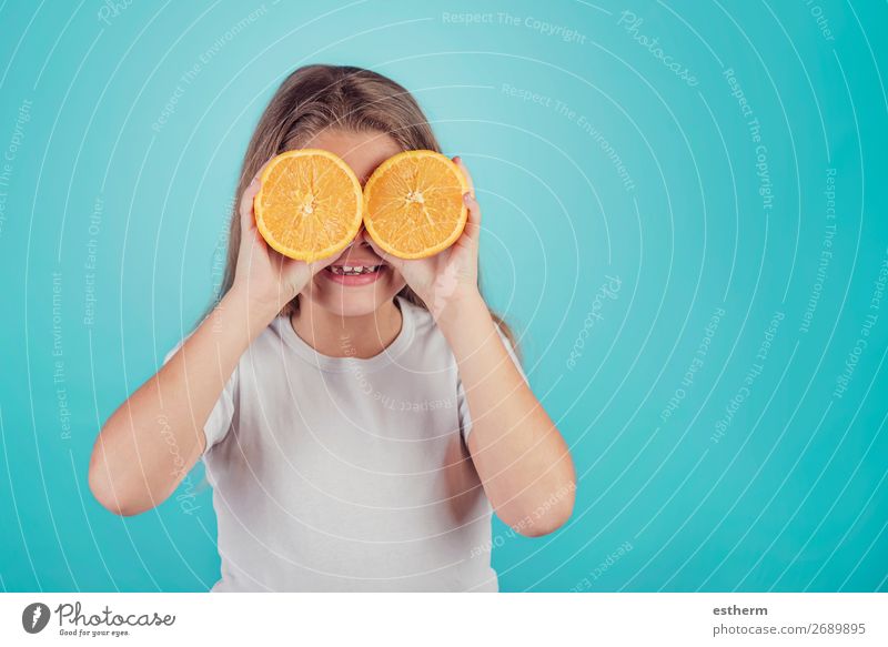 smiling little girl holding oranges over her eyes Fruit Dessert Nutrition Lunch Vegetarian diet Diet Juice Lifestyle Joy Human being Feminine Girl Infancy 1