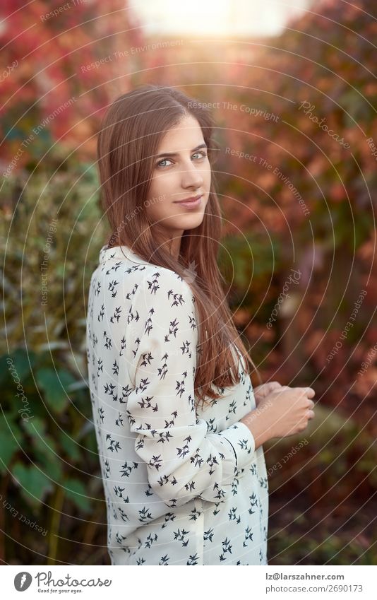 Attractive young woman in a colorful fall street Happy Face Woman Adults 1 Human being 18 - 30 years Youth (Young adults) Autumn Leaf Street Fashion Brunette