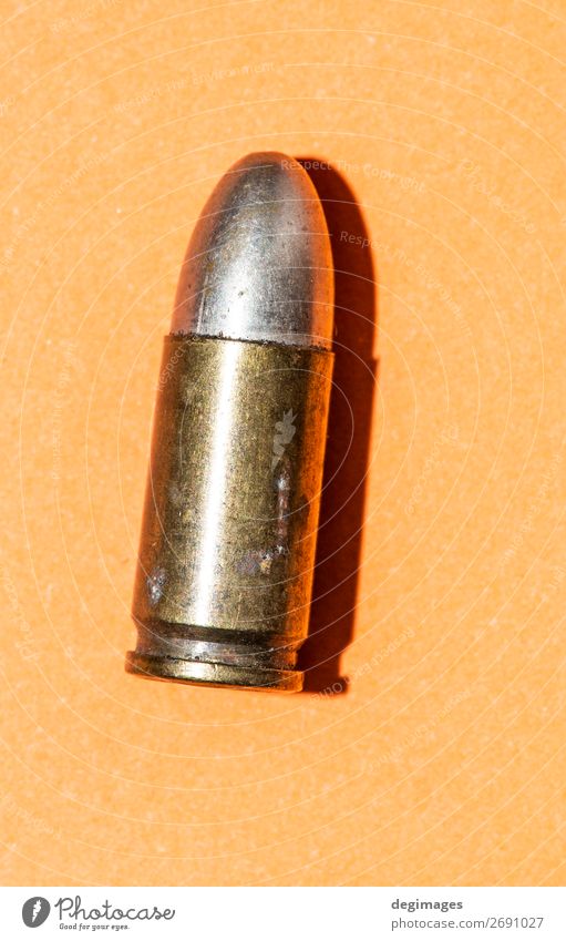 A rifle bullet with gun powder isolated on white. Stock Photo