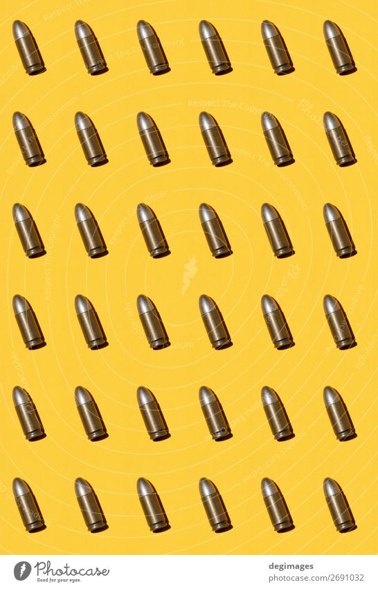 https://www.photocase.com/photos/2691032-weapon-cartridges-ammunitions-background-metal-photocase-stock-photo-large.jpeg