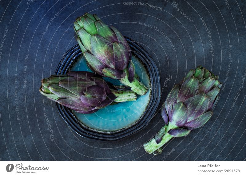 Dark moody artistic image of fresh artichokes Vegetarian diet Wallpaper Kitchen Art Fresh Natural Blue Black Organic background Cooking Gourmet mediterranean