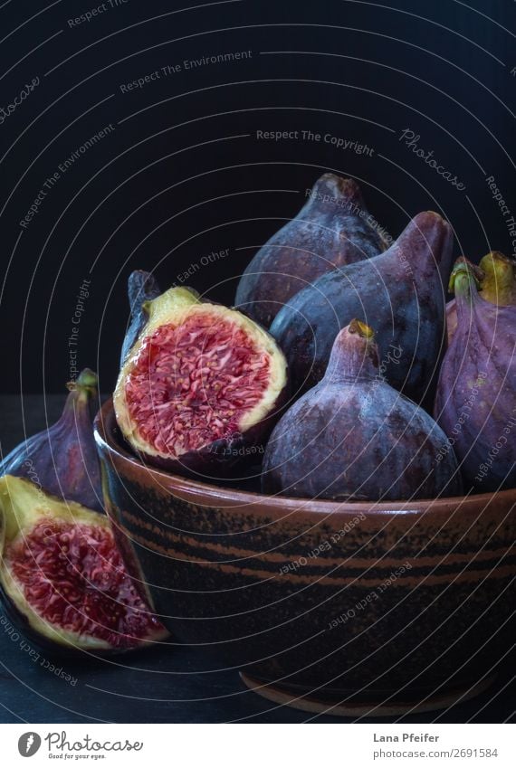 Fine art image of ripe purple figs in a bowl Fruit Nutrition Bowl Design Fresh Black Colour artistic background ceramic Conceptual design Copy Space Fine Art