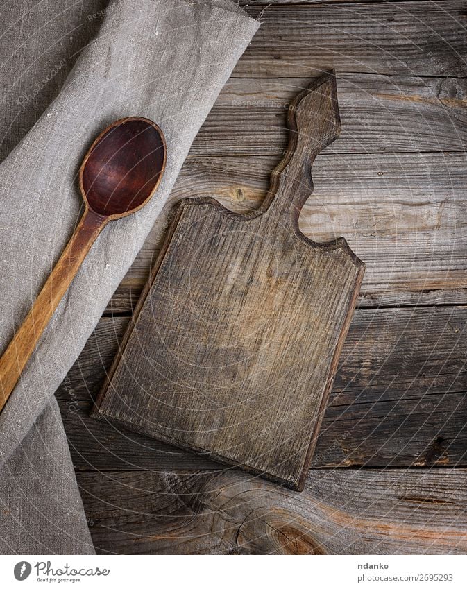 old brown wooden spoon and cutting board Spoon Design Table Kitchen Tool Cloth Wooden spoon Old Above Retro Brown background chopping cooking empty food Grunge