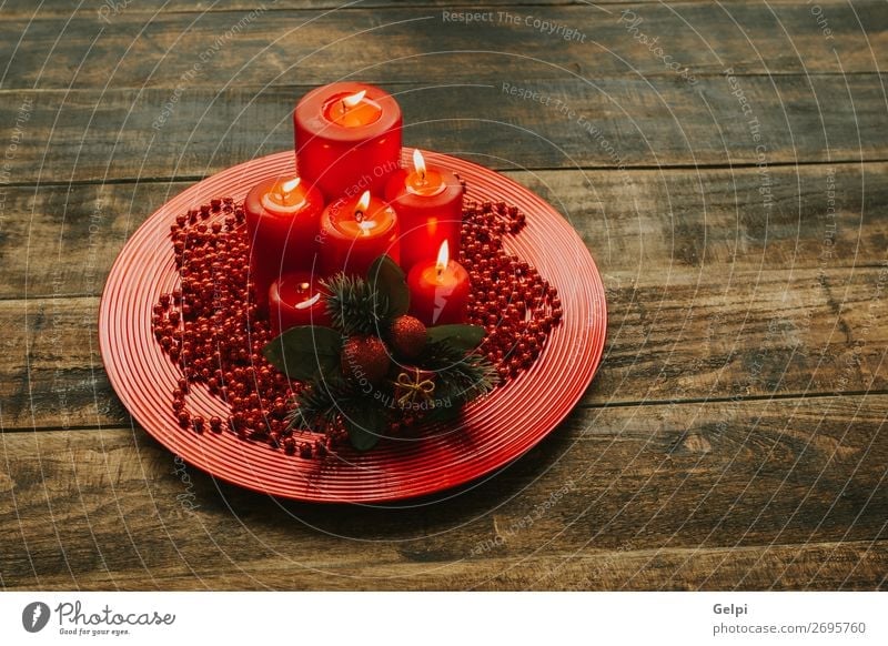 Lighted candles with red colored pearls around Winter Decoration Feasts & Celebrations Christmas & Advent Candle Wood Ornament Glittering Bright Red