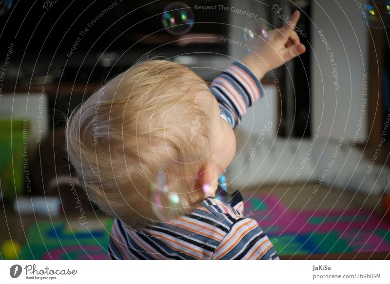 Kid playing with bubbels Playing Children's game Soap bubble Living room Toddler Infancy Life Head Hand 1 Human being 1 - 3 years Observe Touch Catch Blonde