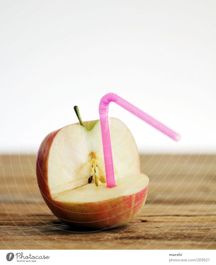 AppleJuice Food Fruit Nutrition Beverage Drinking Cold drink Sweet Green Pink Red Apple juice Blade of grass Funny Wooden table Fresh Fruity Colour photo