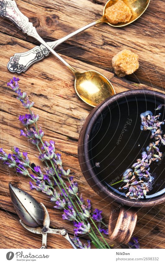 tea with lavender. flower natural herb herbal cup drink beverage plant medicine purple aromatic care healing spoon dry alternative herbal tea relaxation