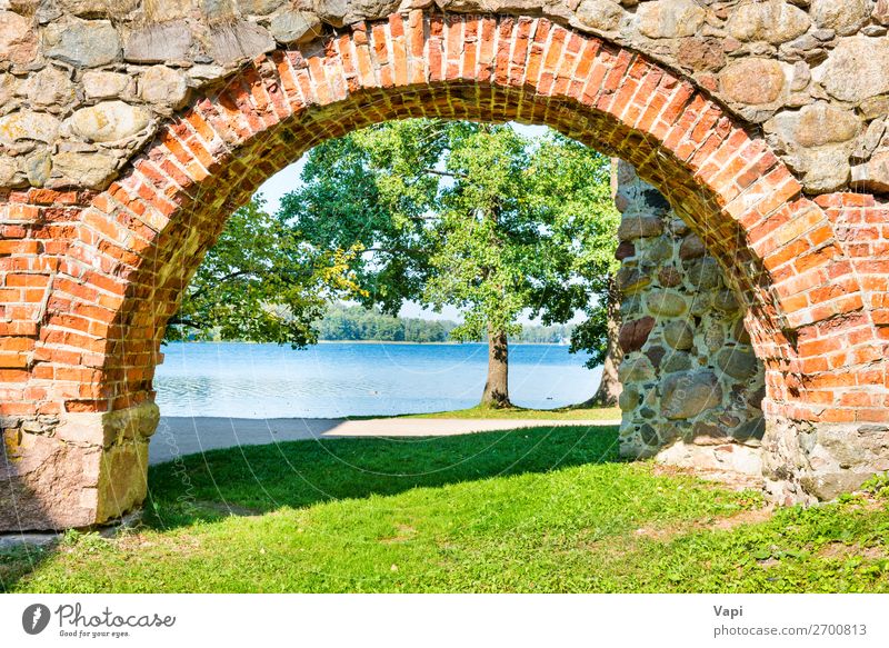 Brick arch and tree near lake Vacation & Travel Tourism Sightseeing Summer Architecture Nature Landscape Water Sunlight Spring Autumn Tree Grass Park Lakeside