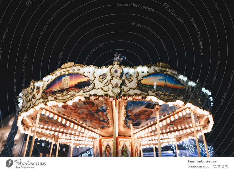 Illuminated carousel Leisure and hobbies Movement Carousel Attraction Fairs & Carnivals Lighting Multicoloured Night sky Evening Electric bulb Colour photo