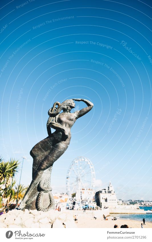 Close-up of a mermaid statue, view of the Atlantic Ocean Port City Vacation & Travel Statue Cascais Portugal Woman Ferris wheel Travel photography Vacation mood