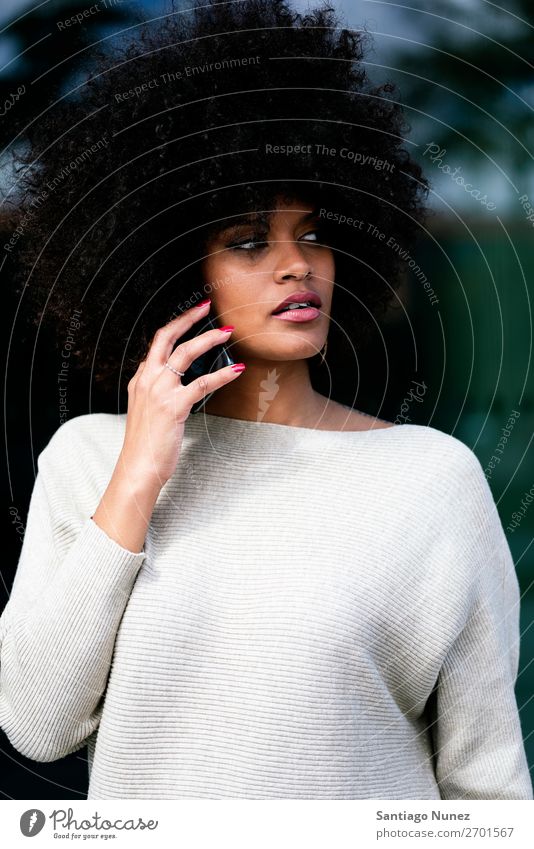 Portrait of attractive afro woman using mobile phone in the street Woman Black African Afro Human being Portrait photograph City Youth (Young adults) Mobile
