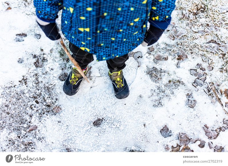 Child´s legs over a frozen ground in winter Lifestyle Relaxation Leisure and hobbies Adventure Winter Snow Winter vacation Mountain Hiking Human being Baby