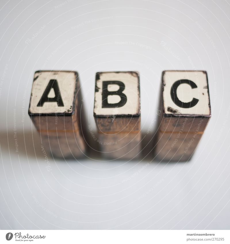 "A B C" Stamp Wood Sign Characters Digits and numbers Old Esthetic Brown Black White Calm Study Know Printing Print shop Colour photo Subdued colour