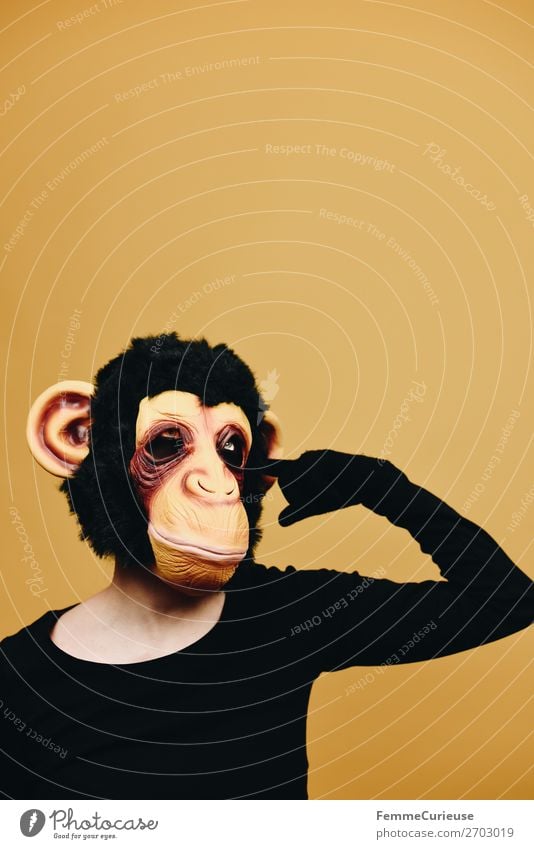 Person with monkey mask drilling in ear 1 Human being Animal Joy Yellow Monkeys Chimpanzee Pelt Latex Ear Humanity Behavior Code of conduct Evolution Carnival