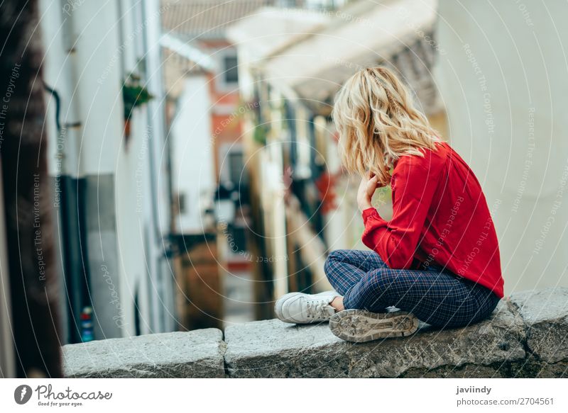 Young woman sitting outdoors looking a beautiful narrow street Lifestyle Style Happy Beautiful Hair and hairstyles Human being Feminine Youth (Young adults)