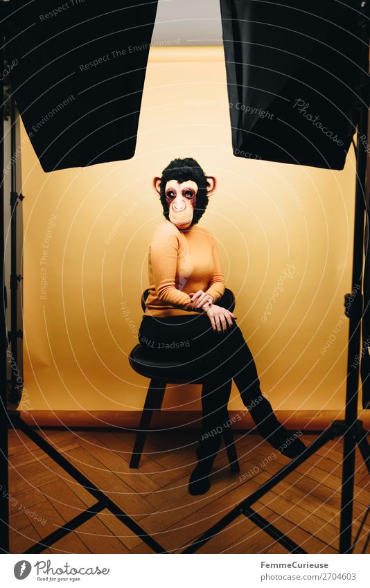 Woman with monkey mask posing in photo studio Feminine Adults 1 Human being 18 - 30 years Youth (Young adults) 30 - 45 years Joy Photographic studio Studio shot
