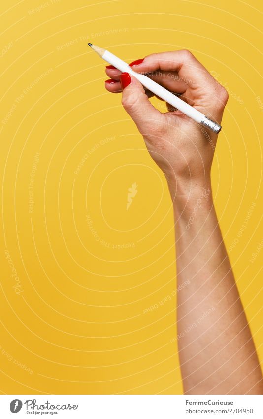 Forearm and hand with pencil against a yellow background Feminine Woman Adults 1 Human being 18 - 30 years Youth (Young adults) 30 - 45 years Creativity