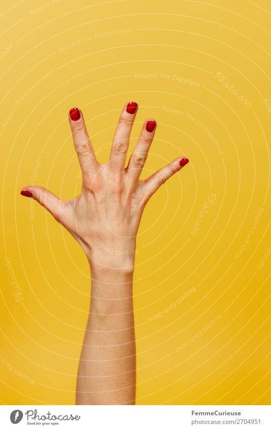 Forearm and hand with spread fingers against a yellow background Feminine Young woman Youth (Young adults) Woman Adults 1 Human being 18 - 30 years