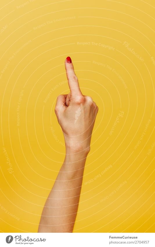 Forearm, hand and index finger against a yellow background Feminine Young woman Youth (Young adults) Woman Adults 1 Human being 18 - 30 years 30 - 45 years