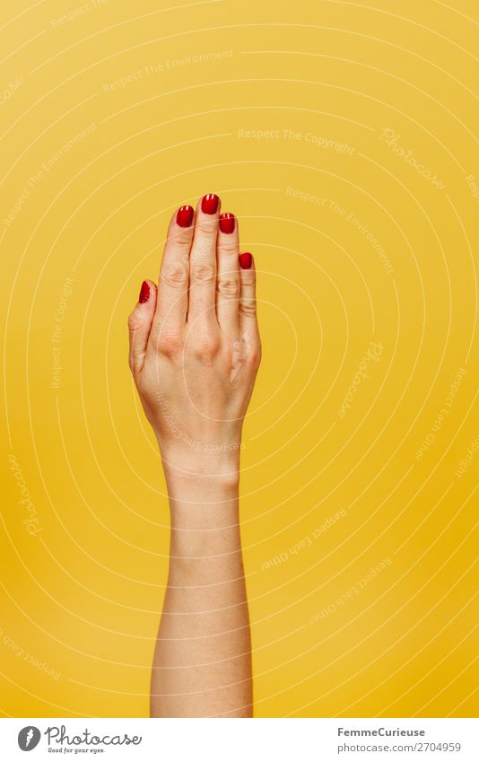 Forearm and hand of a woman in front of a yellow background Feminine Young woman Youth (Young adults) Woman Adults 1 Human being 18 - 30 years 30 - 45 years