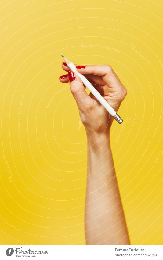 Forearm and hand with pencil against a yellow background Feminine 1 Human being Design Yellow Red Nail polish Pencil Write Writing Draw Hand Fingers Underarm