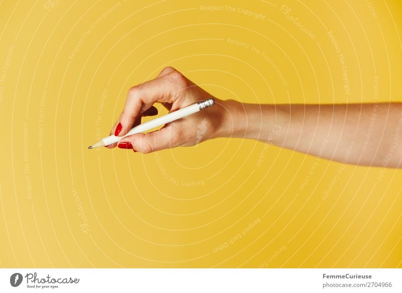Forearm and hand with pencil against a yellow background Feminine Woman Adults 1 Human being 18 - 30 years Youth (Young adults) 30 - 45 years Communicate Write