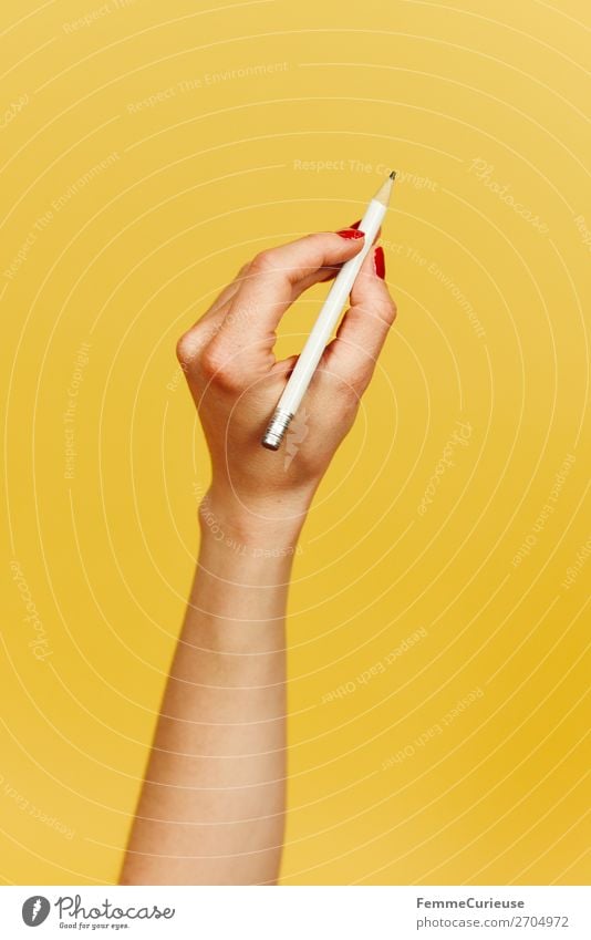 Forearm and hand with pencil against a yellow background Feminine 1 Human being Communicate Design Yellow Write Draw Pencil Hand Underarm Fingers Joint