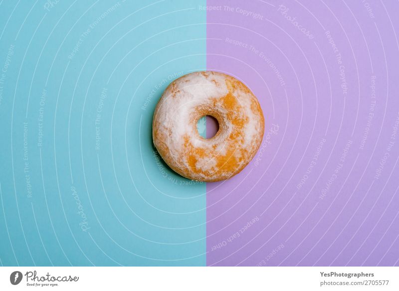 Single donut on blue-violet background. Minimalist flat lay Dessert Breakfast Blue Pink above view Baking Bakery bicolored cake Confectionary Copy Space Donut