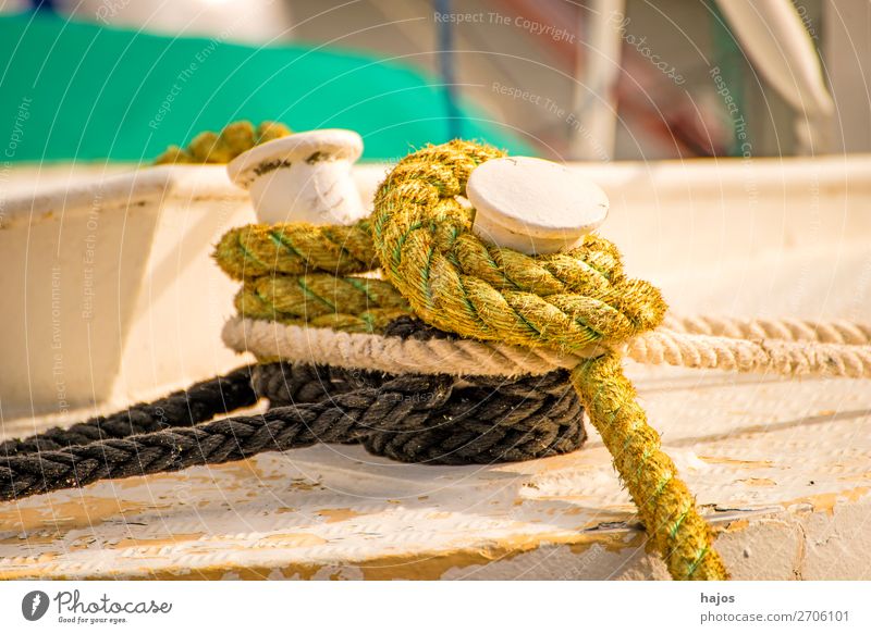 Mooring line on a fishing boat Design Navigation Fishing boat Maritime Brown Multicoloured mooring rope ropes knotted moored lashed fishing cutter pole Harbour