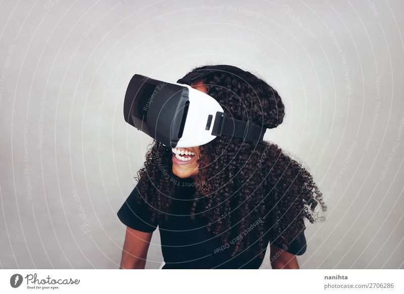 young black woman wears virtual reality VR headset Lifestyle Style Happy Beautiful Hair and hairstyles Leisure and hobbies Playing Headset Games console